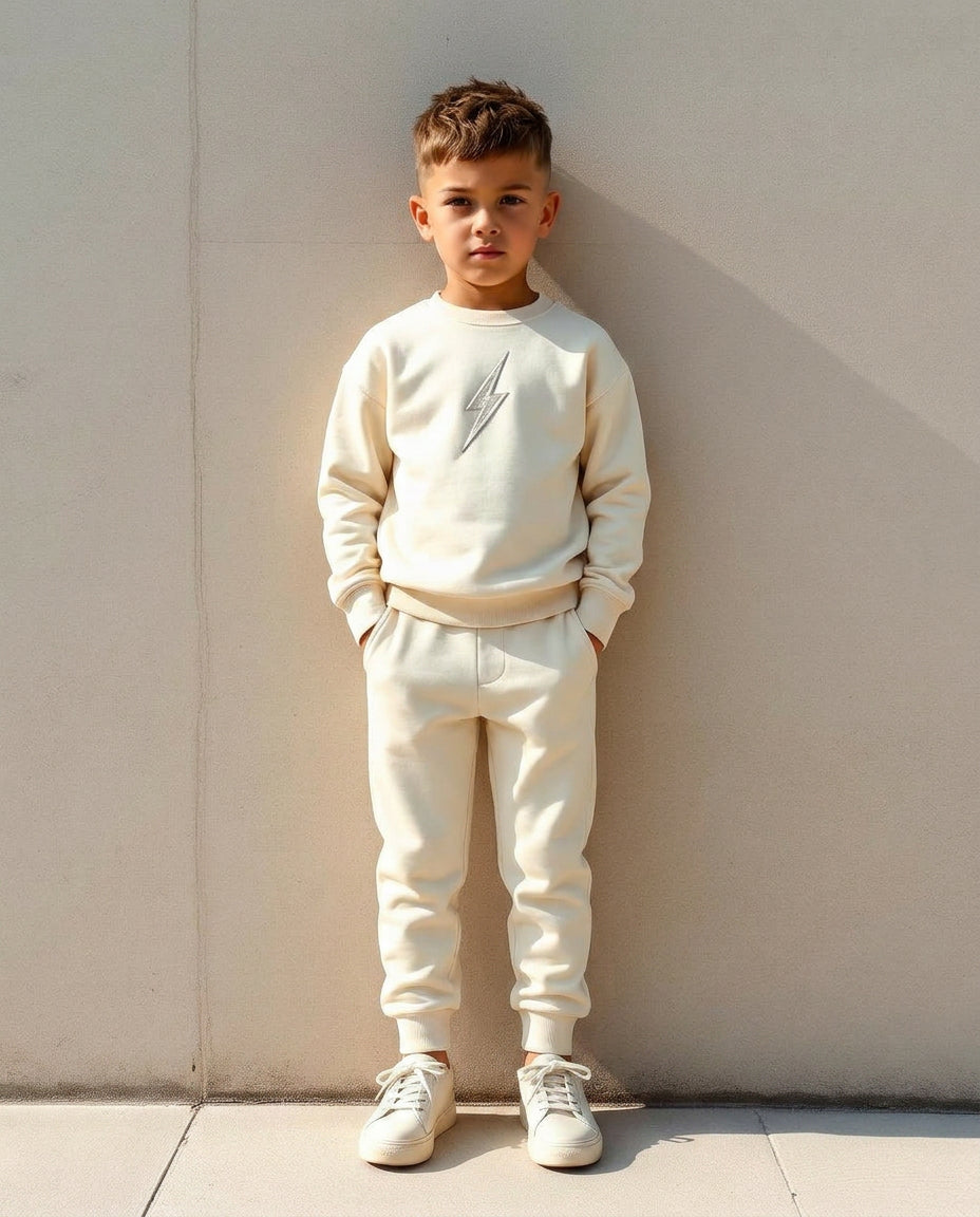 Boy wearing Wild Littles cream bolt joggers